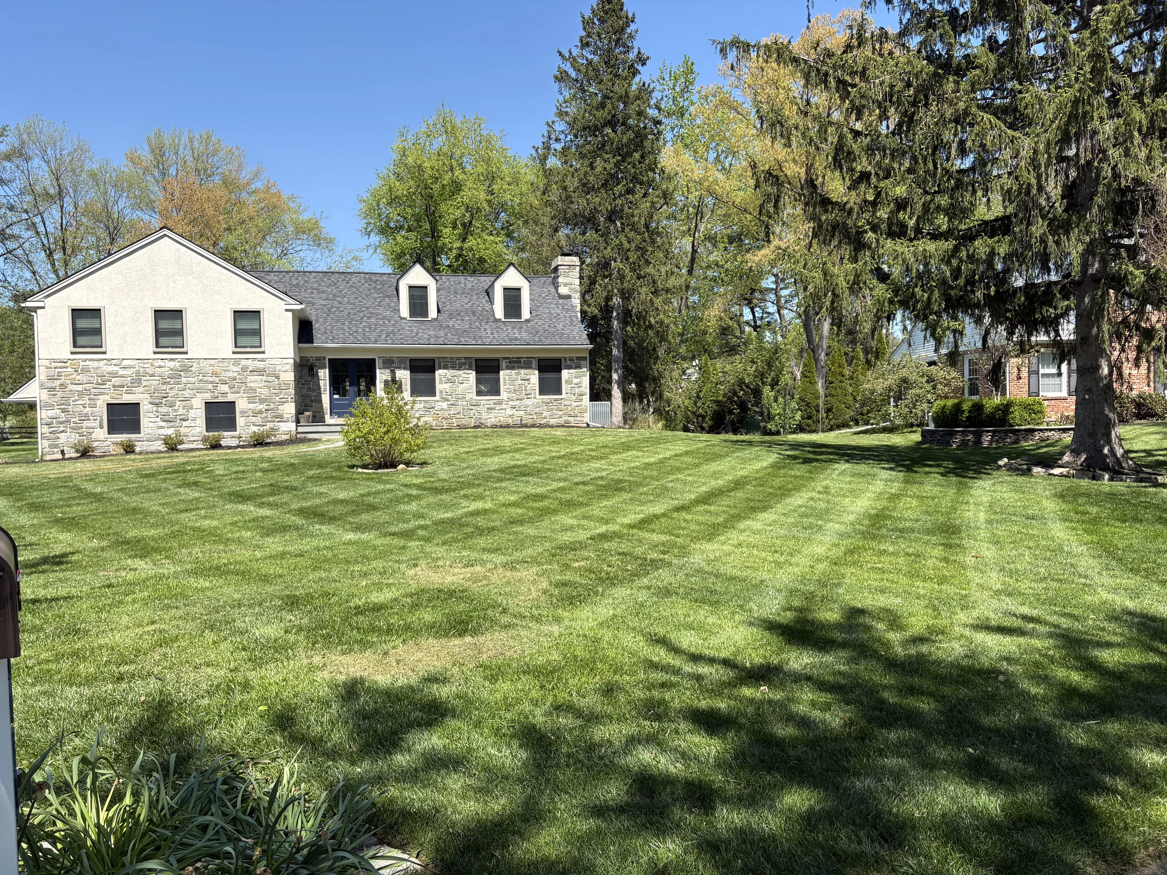 Finished residential lawn maintained by Worthy Landscaping